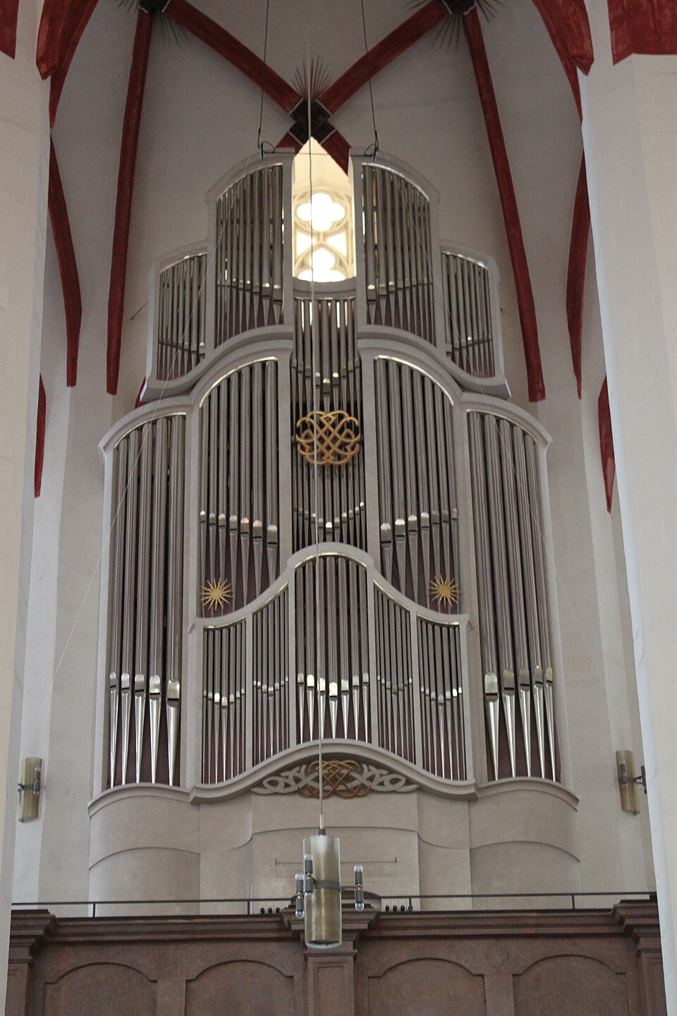 NASA astronaut Anil Menon is attached to the Canadarm2 robotic arm as it guides him toward the worksite where he and ESA astronaut Sophie Adenot (out of frame) installed a space-to-ground antenna on the ISS, August 25, 2026.